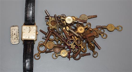 A ladys steel and gold plated Omega manual wind wrist watch retailed by Turler and a quantity of assorted mainly watch keys.